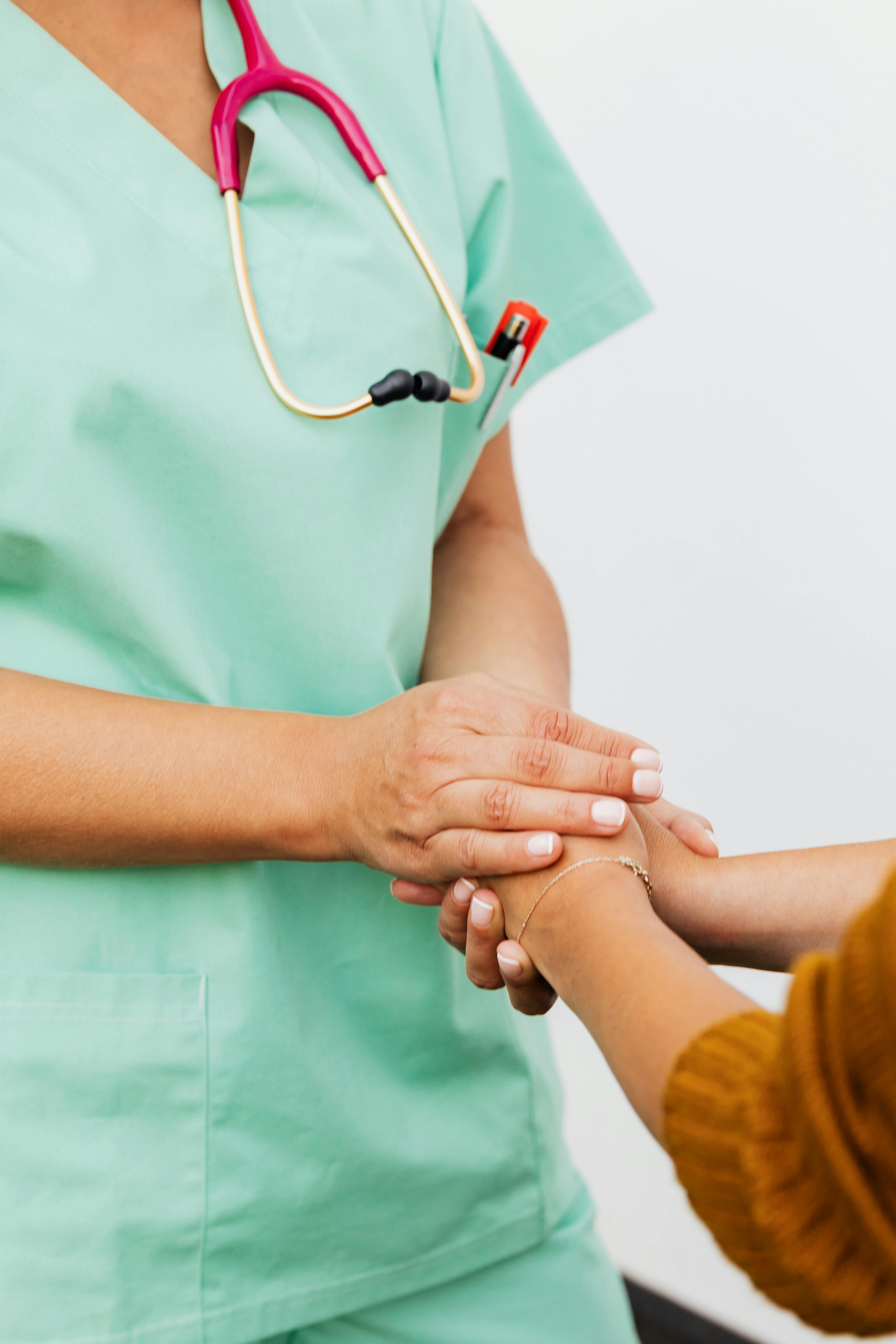 Veterinarian holding hands with a patient